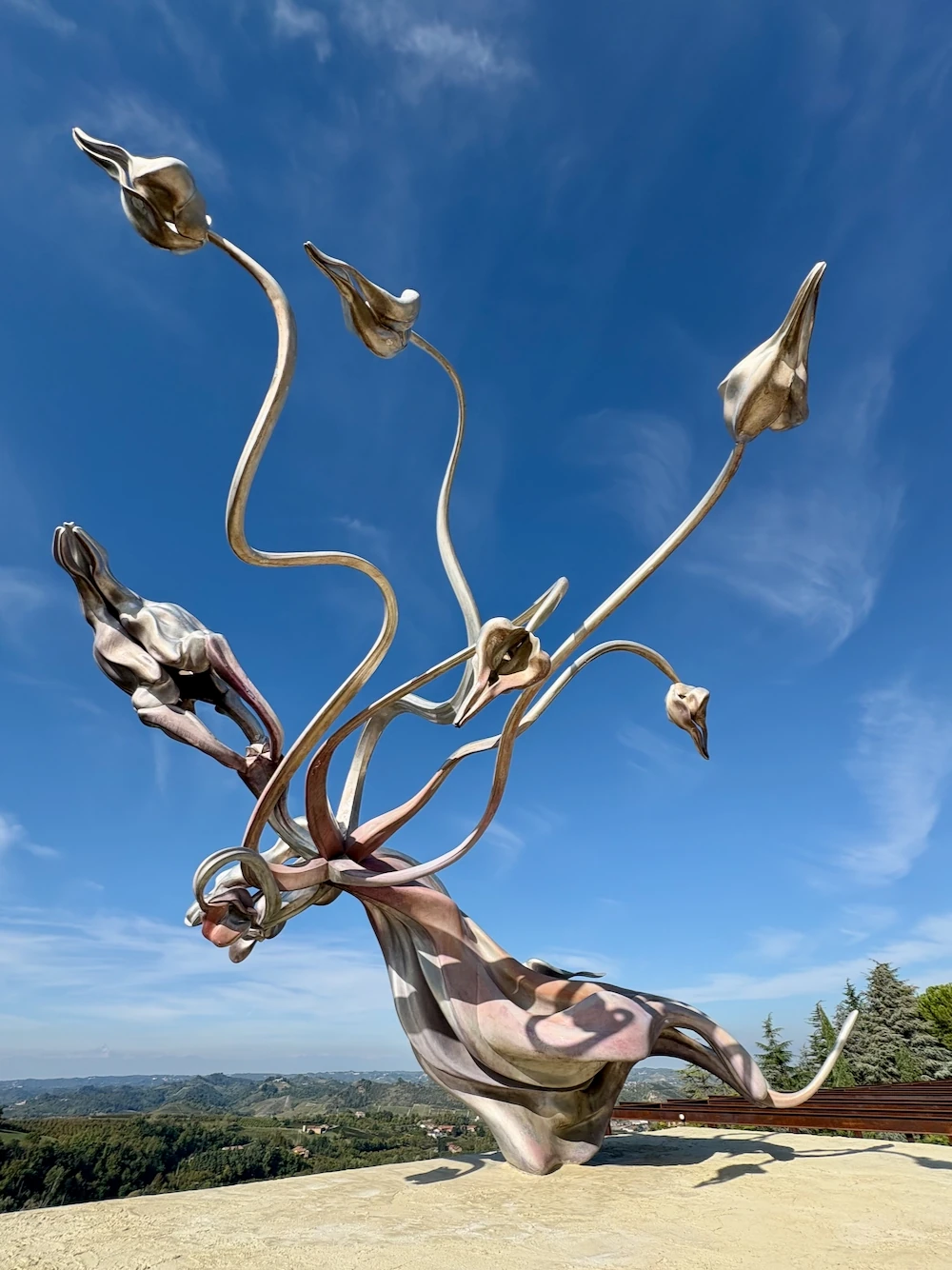 Metal flower sculpture against the sky